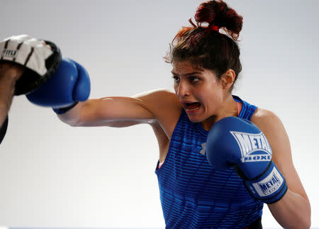 Iranian boxer Sadaf Khadem attends a training session in preparation to her first official boxing bout in Royan, France, April 11, 2019. REUTERS/Regis Duvignau