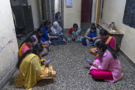 Women learn to use a chatbot powered by artificial intelligence developed by Myna Mahila Foundation at the local women's organization’s office in Mumbai, India, Feb. 1, 2024. The chatbot, currently a pilot project, represents what many hope will be part of the impact of AI on health care around the globe: to deliver accurate medical information in personalized responses that can reach many more people than in-person clinics or trained medical workers. (AP Photo/Rafiq Maqbool)