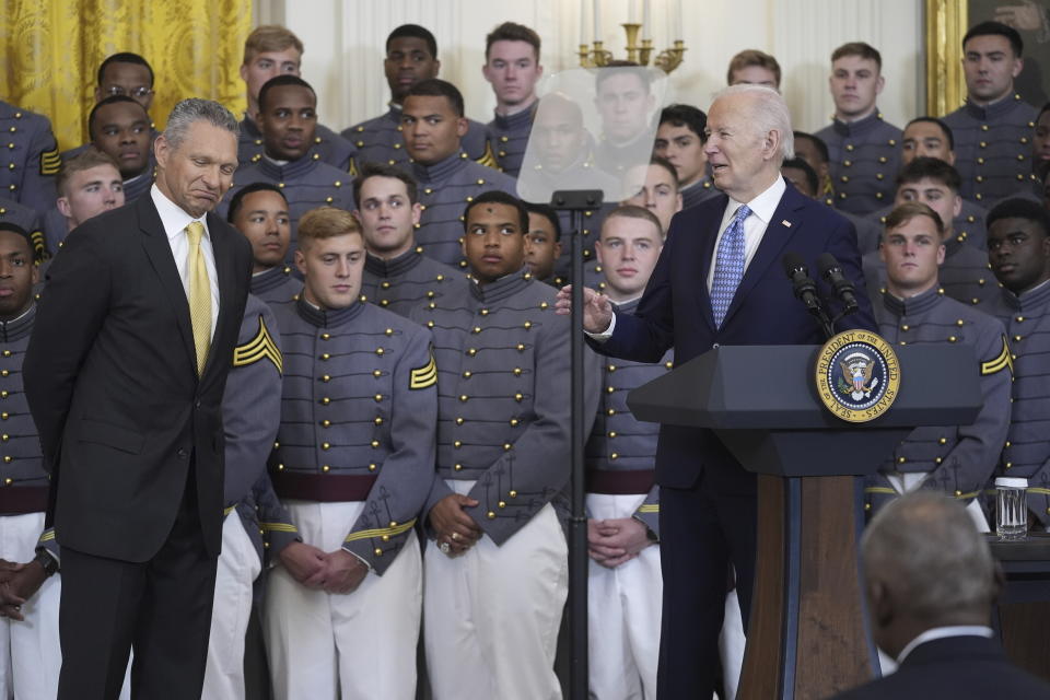 President Joe Biden speaks during an event to present the Commander-in-Chief's Trophy to the United States Military Academy Army Black Knights, in the East Room of the White House, Monday, May 6, 2024, in Washington, as head coach Tom Monken, left, looks on. (AP Photo/Evan Vucci)