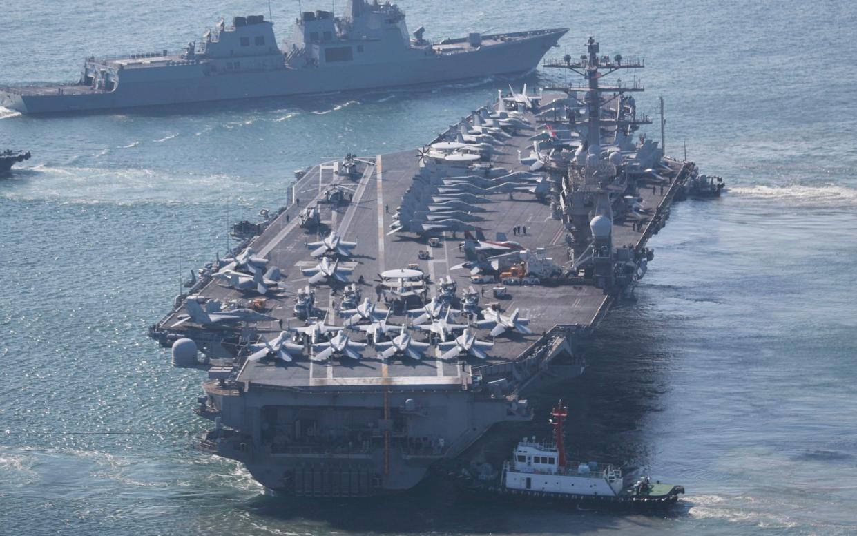 The U.S. Navy's nuclear-powered aircraft carrier USS Nimitz departs a naval base in Busan, South Korea, Sunday, April 2, 2023 - Cha Geun-ho/Yonhap via AP
