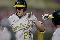 Oakland Athletics' Stephen Piscotty (25) celebrates after hitting a grand slam off San Francisco Giants' Trevor Gott in the ninth inning of a baseball game, Friday, Aug. 14, 2020, in San Francisco. (AP Photo/Ben Margot)