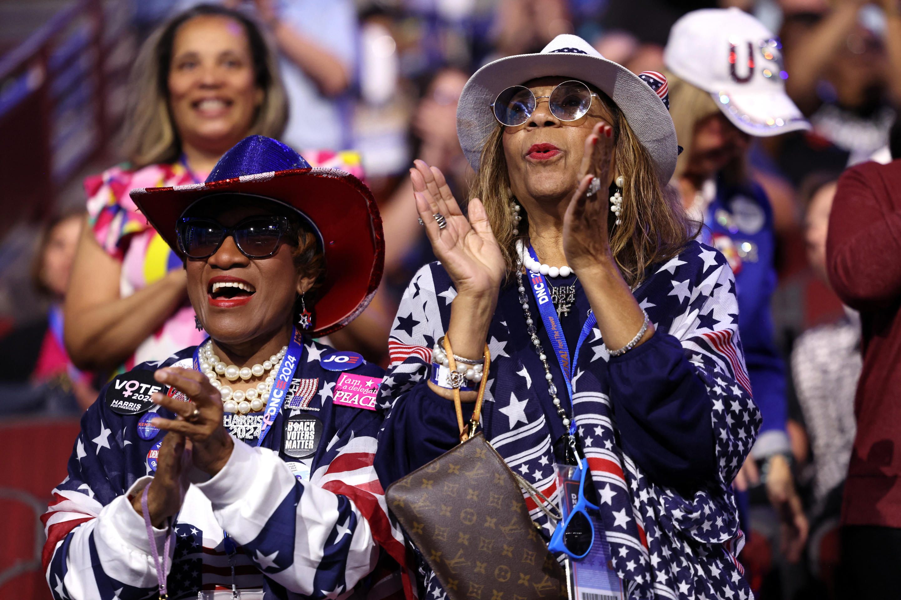 Delegates applaud on the first day of the Democratic National Convention at the United Center in Chicago. (Charly Triballeau/AFP via Getty Images)