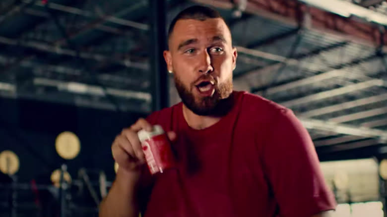 Travis Kelce holding gummies 