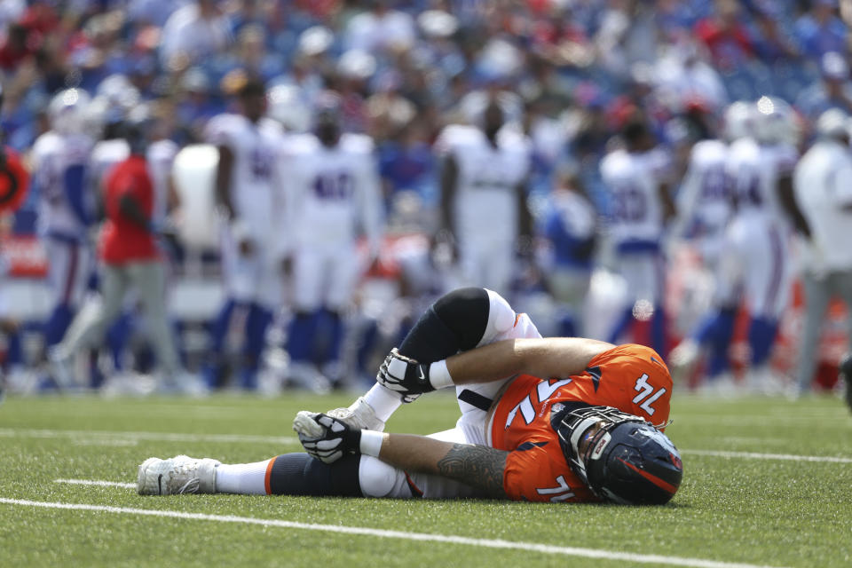 Denver Broncos' Casey Tucker reacts after an injury during the second half of a preseason NFL football game against the Buffalo Bills, Saturday, Aug. 20, 2022, in Orchard Park, N.Y. (AP Photo/Joshua Bessex)