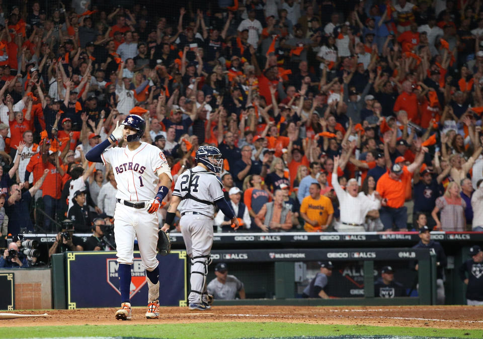 Oct 13, 2019; Houston, TX, USA; Houston Astros shortstop Carlos Correa (1) celebrates after hitting a walk off solo home run off of New York Yankees starting pitcher J.A. Happ (not pictured) during the eleventh inning in game two of the 2019 ALCS playoff baseball series at Minute Maid Park. Mandatory Credit: Thomas B. Shea-USA TODAY Sports