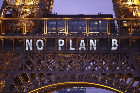 The slogan "No Plan B" is projected on the Eiffel Tower as part of the World Climate Change Conference 2015 (COP21) in Paris, France, December 11, 2015. REUTERS/Charles Platiau