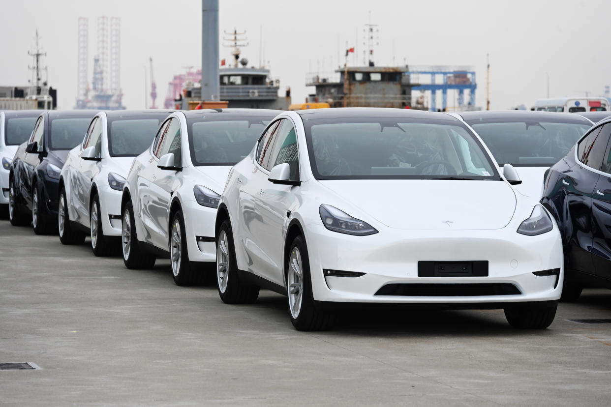 SHANGHAI, CHINA - MAY 15: A total of 4,027 Tesla Model Y and Model 3 electric vehicles, which will be sent to the Port of Zeebrugge in Belgium, wait to be loaded on board the roll-on-roll-off cargo vessel Theben operated by Wallenius Wilhelmsen at Nangang port on May 15, 2022 in Shanghai, China. (Photo by Shen Chunchen/VCG via Getty Images)