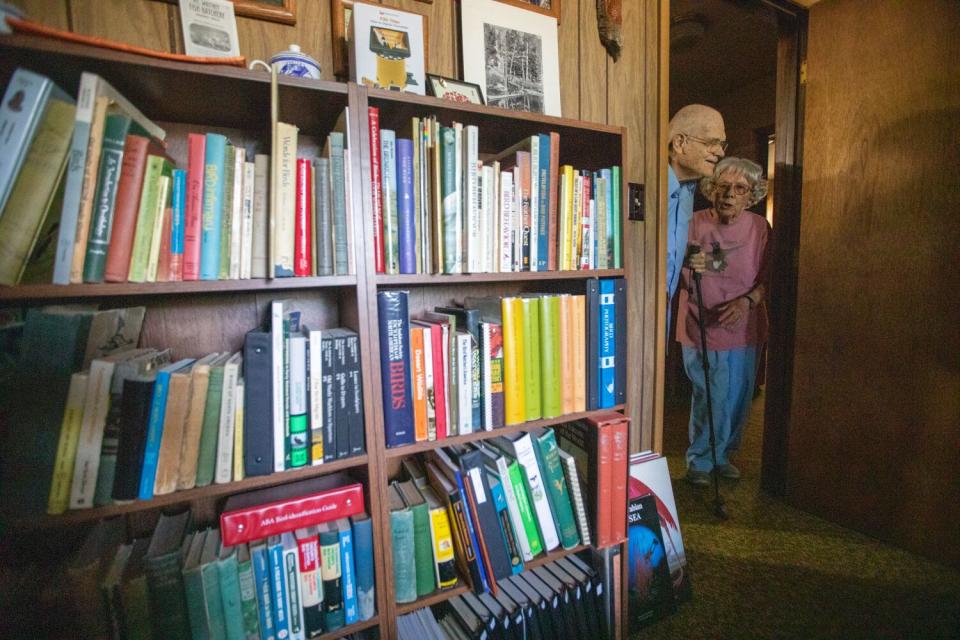 Tom and Joanne Heindel in a doorway of their book-filled home in Big Pine.