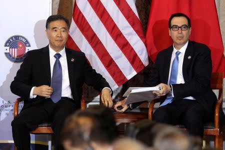 U.S. Treasury Secretary Steve Mnuchin and China's Vice Premier Wang Yang attend the U.S. - China Comprehensive Economic Dialogue to discuss bilateral economic and trade issues in Washington, U.S., July 19, 2017. REUTERS/Yuri Gripas