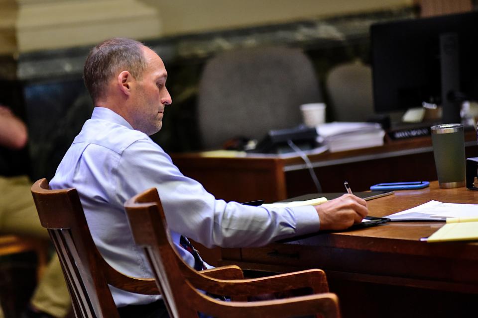 Thomas Brown, 50, of Bucyrus, takes notes during the first day of his trial. He faces two counts of murder in the January 2023 death of Sean Cassaro.