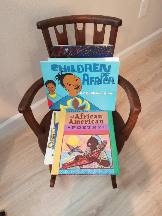 "Children of Africa" was published by Drum and Spear Press. Daphne Muse, who worked there, is passing it on to her 14-month-old great-grandson Mason who has a library of more than 300 books. The rocking chair belonged to Muse's great-grandmother Daphne Allen when she was a child circa the 1870s.