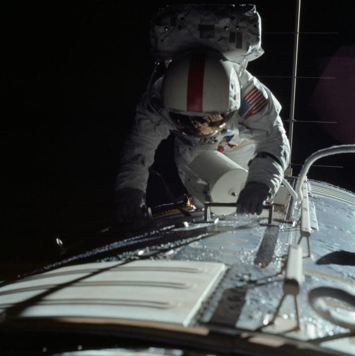 (17 Dec. 1972) — Astronaut Ronald E. Evans is photographed performing extravehicular activity during the Apollo 17 spacecraft’s trans-Earth coast. During his EVA, command module pilot Evans retrieved film cassettes from the Lunar Sounder, Mapping Camera, and Panoramic Camera. The cylindrical object at Evans’ left side is the Mapping Camera cassette. The total time for the trans-Earth EVA was one hour seven minutes 18 seconds. (NASA)