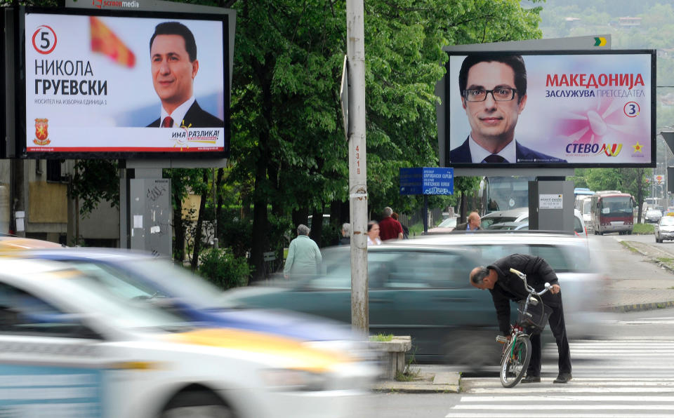 In this photo taken Thursday, April 24, 2014, an electoral poster of Macedonian Prime Minister and leader of the ruling conservative VMRO-DPMNE party Nikola Gruevski, left, reading "There is a difference - You know how to recognize it" and a poster of the Presidential candidate Stevo Pendarovski, right, supported by the opposition Social-democrats, with a slogan "Macedonia Deserves a President", are seen in Macedonia's capital Skopje. Macedonia’s ruling conservatives are vying to cement their dominance in twin elections for prime minister and president Sunday, gambling on the success of their economic program despite high unemployment and failure to resolve a dispute with neighbor Greece that kept the tiny country from joining NATO entry and achieving closer ties with the European Union. (AP Photo/Boris Grdanoski)