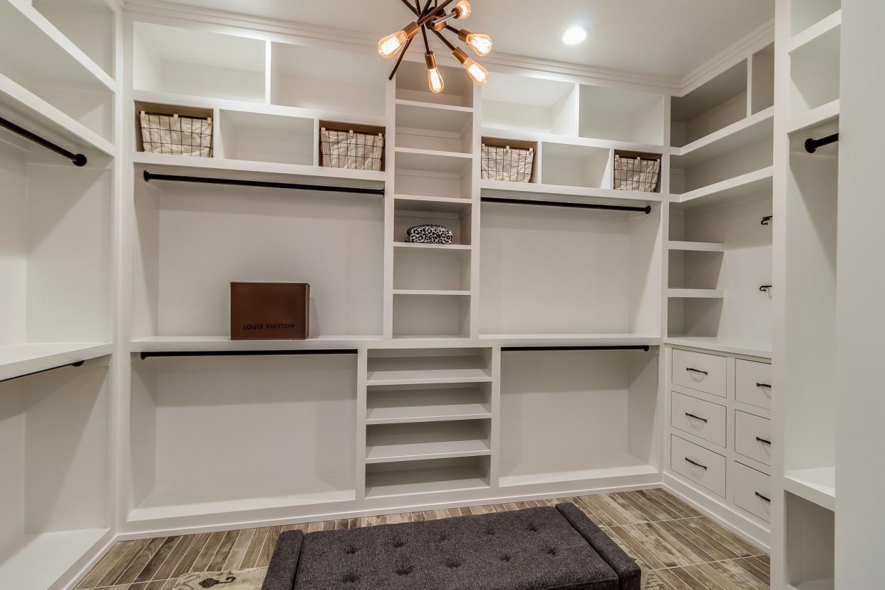 Modern light fixture in center of walk-in closet