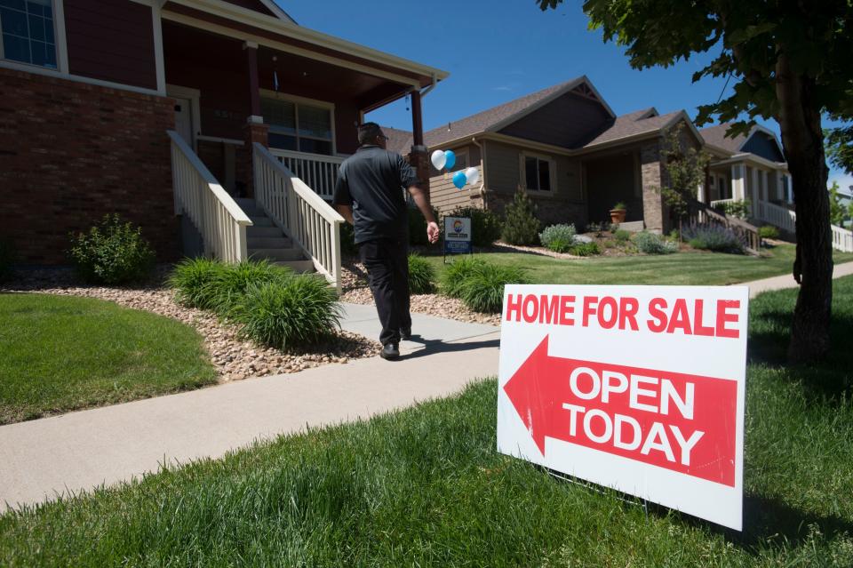 Realtor Chance Basurto prepares for an open house at a home for sale in west Greeley on May 26, 2018.