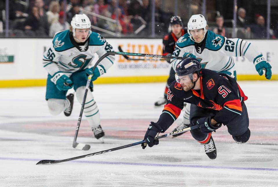 Shane Wright of the Coachella Valley Firebirds gets airborne chasing a puck during their game against the San Jose Barracuda at Acrisure Arena in Palm Desert, Calif., Feb. 28, 2024.