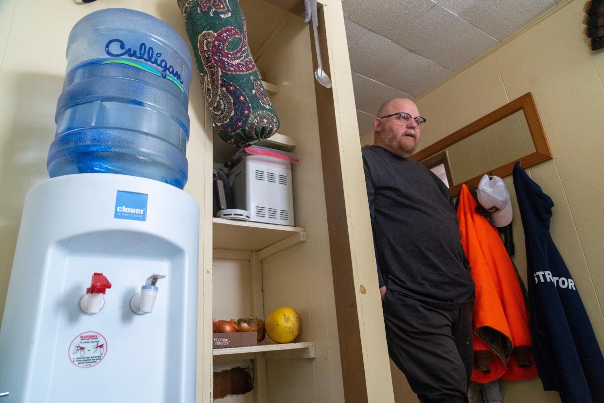 Tim Gerdmann has been drinking bottled water since early November after his well water was found to have high levels of PFAS in it. He is shown Wednesday, December 28, 2022, in the Town of Stella in rural Oneida County, Wis. Private wells in this northern Wisconsin town near Rhinelander have tested positive for "forever chemicals" at levels so high the water in them can no longer be safely consumed by residents.