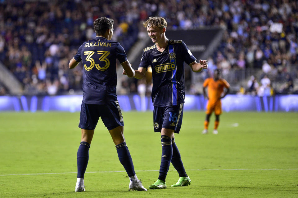 Philadelphia Union's Quinn Sullivan (33) celebrates with Jack McGlynn, right, after scoring a goal during the second half of an MLS soccer match against the Houston Dynamo, Saturday, July 30, 2022, in Chester, Pa. (AP Photo/Derik Hamilton)