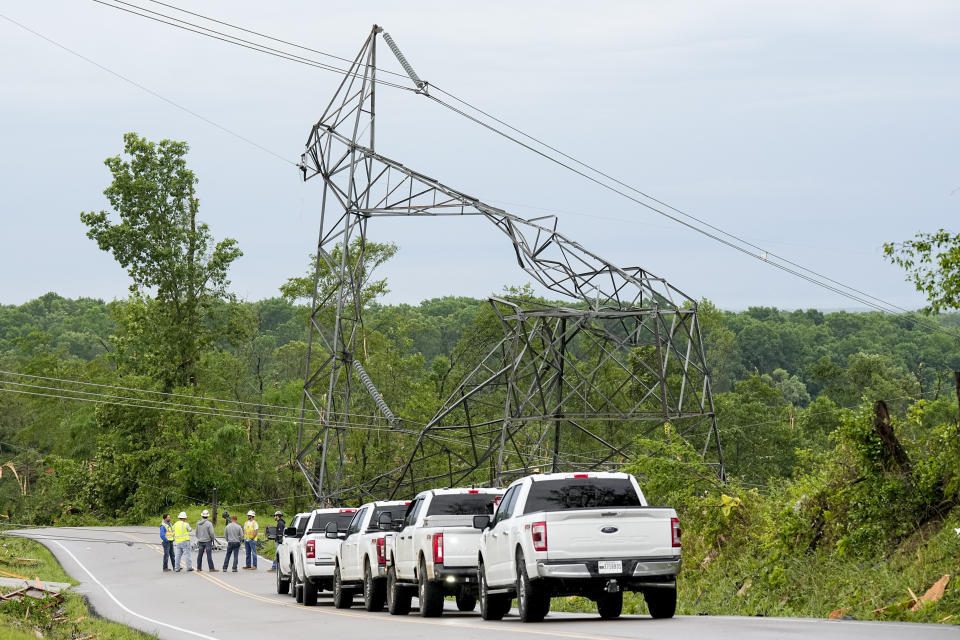 Utility workers survey a damaged TVA tower Thursday, May 9, 2024, in Columbia, Tenn. Severe storms tore through the central and southeast U.S., Wednesday, spawning damaging tornadoes, producing massive hail, and killing two people in Tennessee. (AP Photo/George Walker IV)