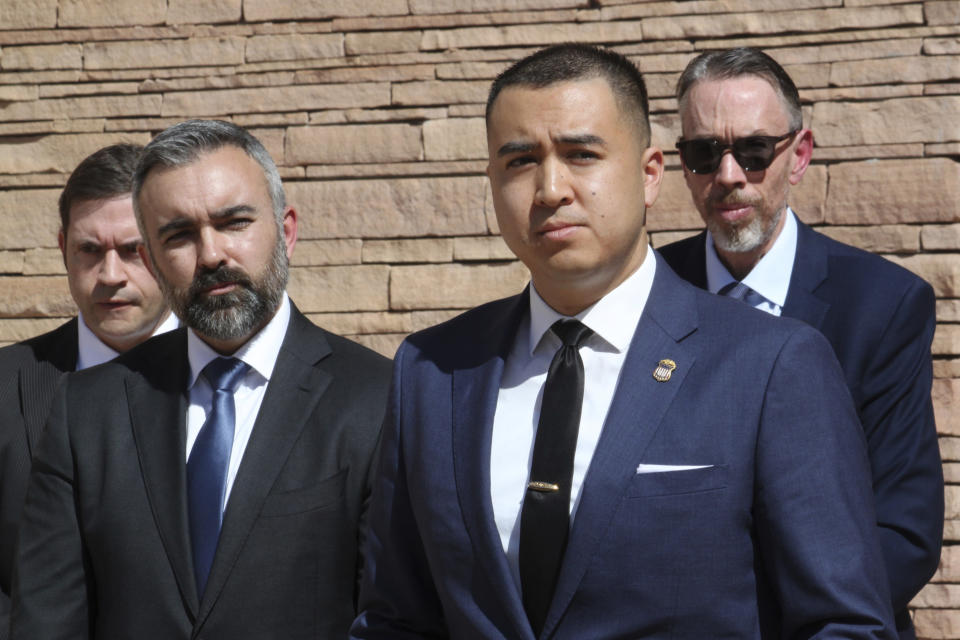 U.S. Attorney for the district of New Mexico Alexander Uballez, right foreground, and New Mexico Attorney General Raul Torrez, left, take questions during a news conference in Albuquerque, N.M., on Friday, March 22, 2024. Authorities announced that federal charges were filed against Jaremy Smith in the March 15, 2024, killing of New Mexico State Police Officer Justin Hare. (AP Photo/Susan Montoya Bryan)