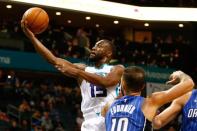Oct 29, 2017; Charlotte, NC, USA; Charlotte Hornets guard Kemba Walker (15) goes up for a shot against Orlando Magic guard Evan Fournier (10) in the second half at Spectrum Center. Jeremy Brevard-USA TODAY Sports