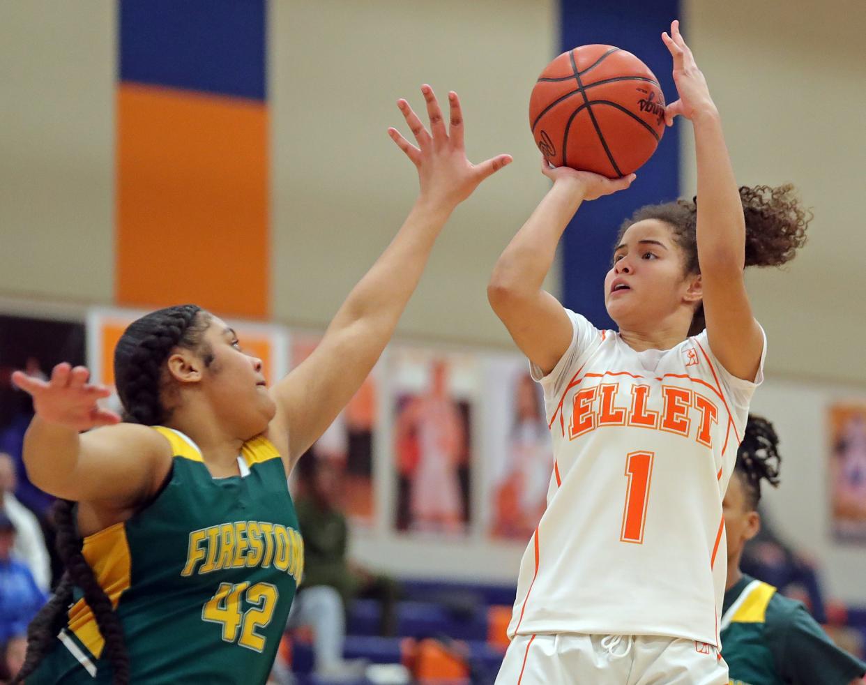 Ellet's Caitlyn Holmes, right, makes a shot over Firestone's Sarae Stallworth during the first half, Monday, Jan. 23, 2023.