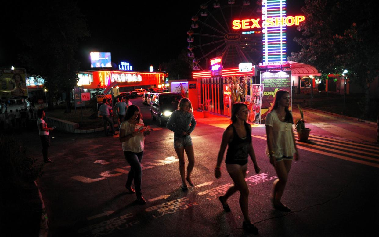 Tourists on a night out in Bulgaria's brashest Black Sea resort, Sunny Beach - AFP