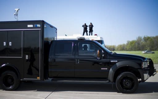 Members of the Secret Service counter sniper team keep watch as US President Barack Obama's motorcade prepares to leave the Detroit Metro Wayne County Airport on April 18. More agents will be forced out of the Secret Service as early as Thursday, a US lawmaker said, as the White House warned foes not to "politicize" the prostitution scandal blighting the agency