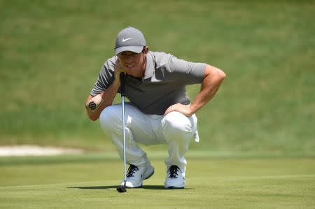 Aug 11, 2018; Saint Louis, MO, USA; Rory McIlroy lines up a putt on the 4th green during the third round of the PGA Championship golf tournament at Bellerive Country Club. Mandatory Credit: John David Mercer-USA TODAY Sports