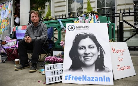 Richard Ratcliffe, the husband of imprisoned Nazanin Zaghari-Ratcliffe, protesting outside the Iranian Embassy in London - Credit: Rex