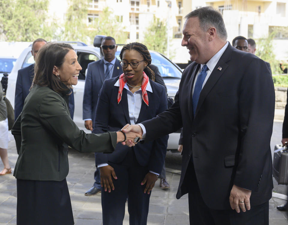 US Secretary of State, Mike Pompeo, right, shakes hands with US Ambassador to the African Union, Jessica Lapenn, as the Executive Secretary of the Economic Commission for Africa, Vera Songwe, centre, looks on as he arrives at the United Nations Economic Commission for Africa in Addis Ababa on Wednesday Feb. 19, 2020.(Andrew Caballero-Reynolds/Pool via AP)