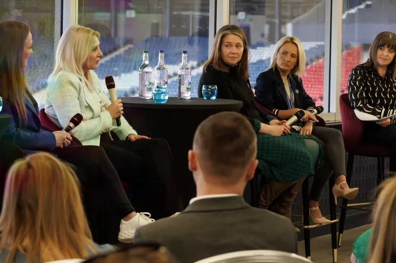 People having a meeting at a football stadium