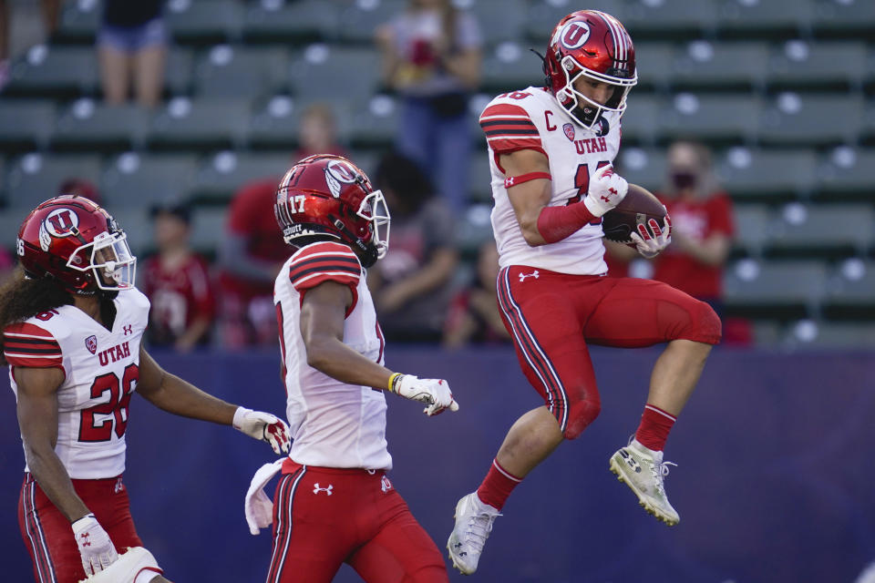 Utah wide receiver Britain Covey (18) celebrates after scoring a touchdown during the first half of an NCAA college football game against San Diego State Saturday, Sept. 18, 2021, in Carson, Calif. (AP Photo/Ashley Landis)