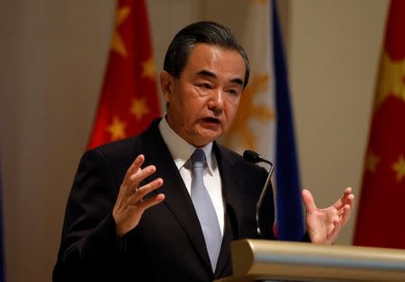 China's Foreign Minister Wang Yi speaks during a joint news conference with his Philippine counterpart Foreign Affairs secretary Alan Peter Cayetano (not pictured) in Taguig, Metro Manila Philippines July 25, 2017. REUTERS/Erik De Castro