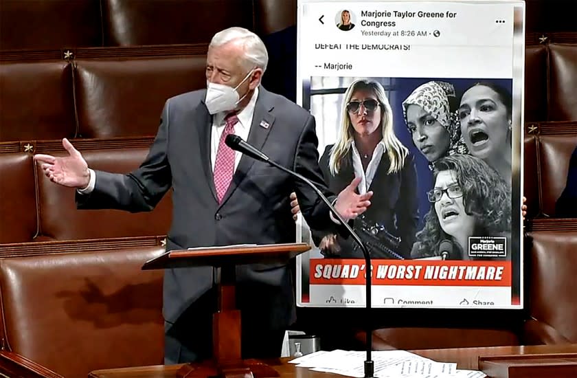 WASHINGTON, D.C. - FEB. 4, 2021 - Majority House Leader Steny Hoyer displays a political ad for freshman Rep. Marjorie Taylor Greene, where she is holding an AR-15 rifle near the heads of Democratic representatives Ilhan Omar, Alexandria Ocasio Cortez and Rashida Tlaib, members of the so-called "Squad." (U.S. House of Representatives)