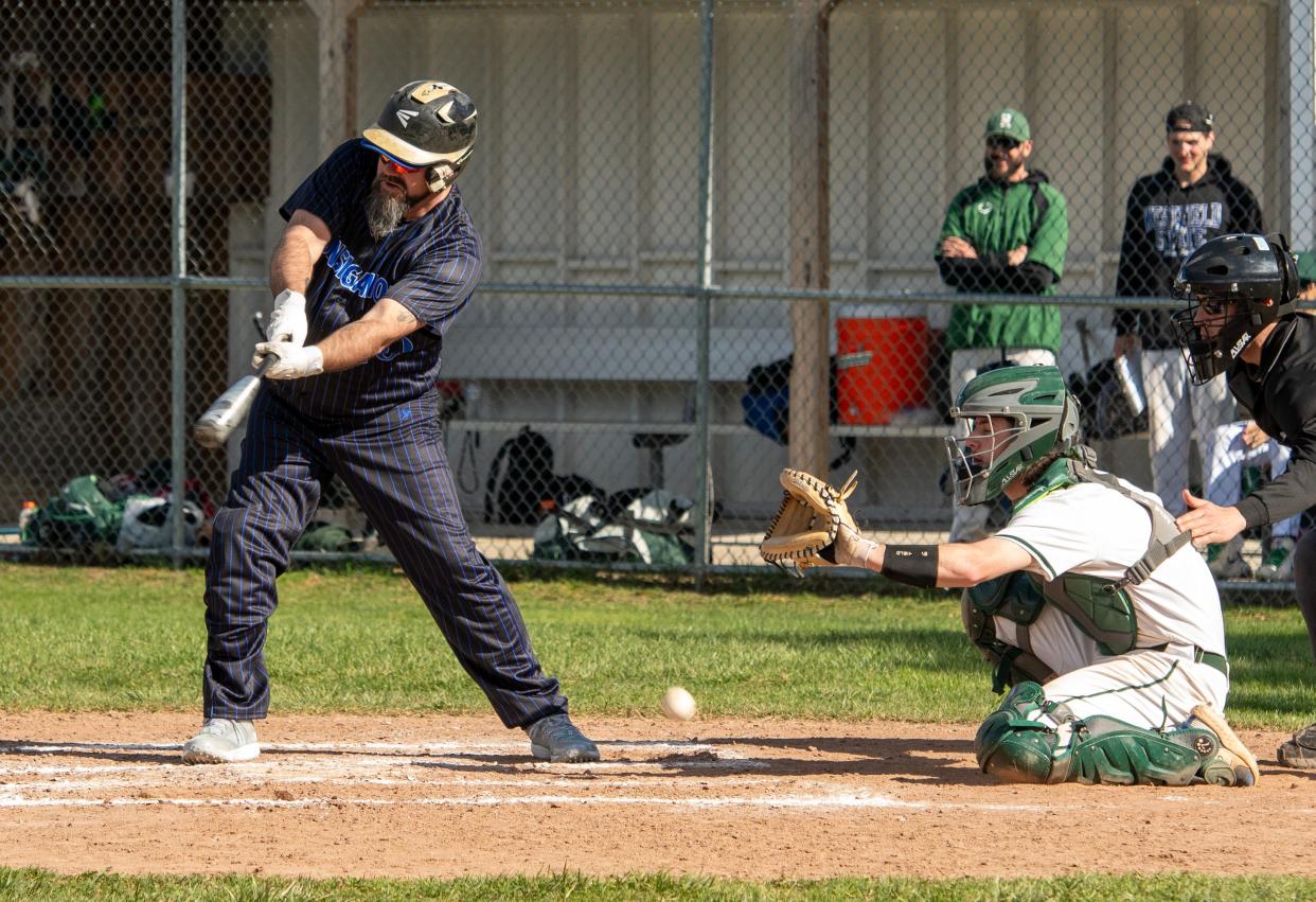 Quinsigamond's Paul Landry fouls a pitch.