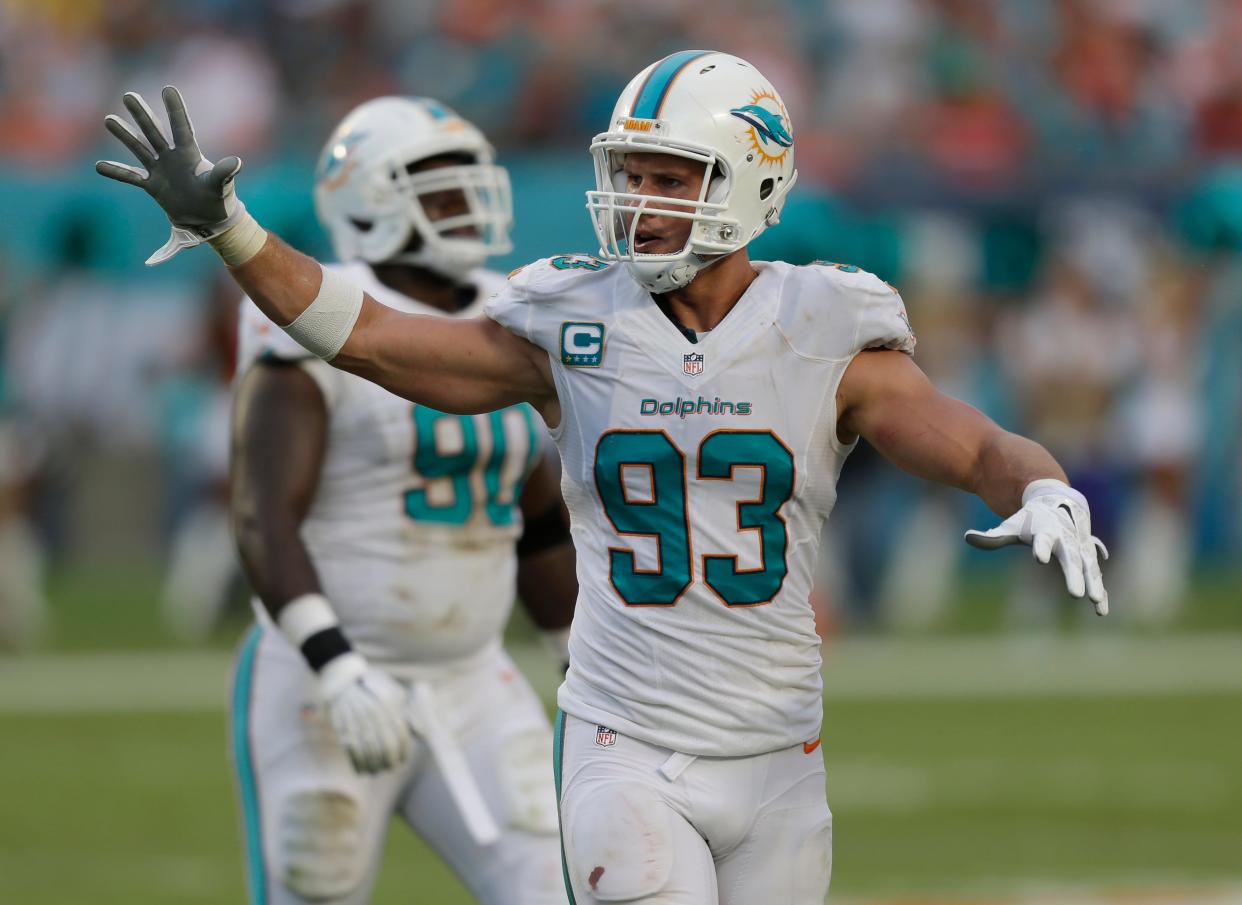 Miami Dolphins outside linebacker Jason Trusnik (93) gestures on the field during the second half of an NFL football game against the Kansas City Chiefs, Sunday, Sept. 21, 2014, in Miami Gardens, Fla. (AP Photo/Wilfredo Lee)