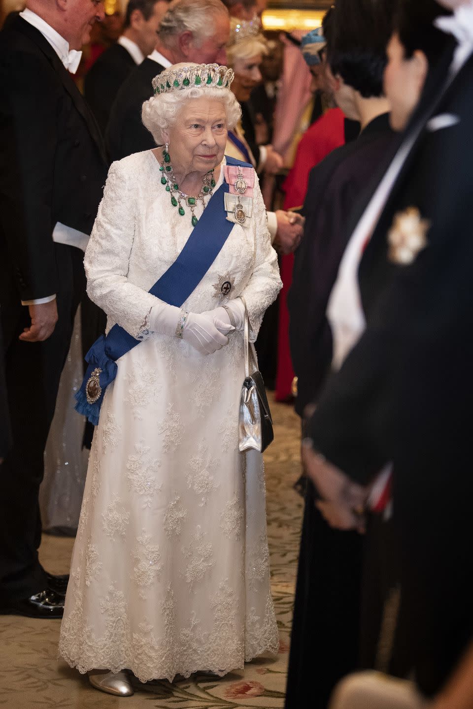 <p>At a Buckingham Palace reception for the Diplomatic Corps, the Queen stunned in a white gown and emerald jewels.</p>