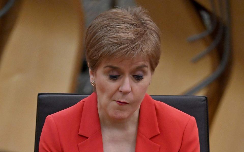Nicola Sturgeon appeared to contradict Jeane Freeman about when the roll-out would be completed - AFP