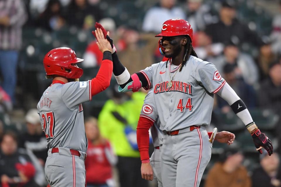 Elly De La Cruz is greeted by Jake Fraley after hitting his  three-run home run in the Reds' five-run third inning. The homer was De La Cruz's fourth in four games this week.