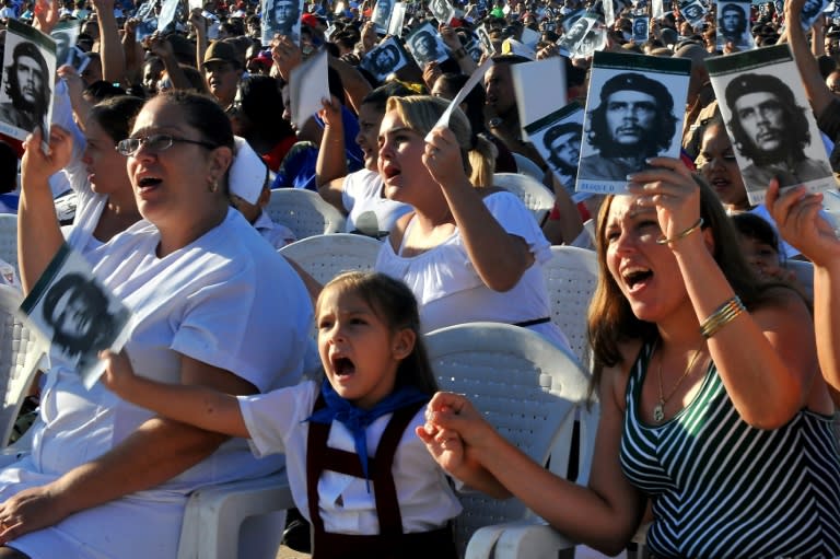 Cubans attend a ceremony marking the 50th anniversary of the death of Ernesto "Che" Guevara