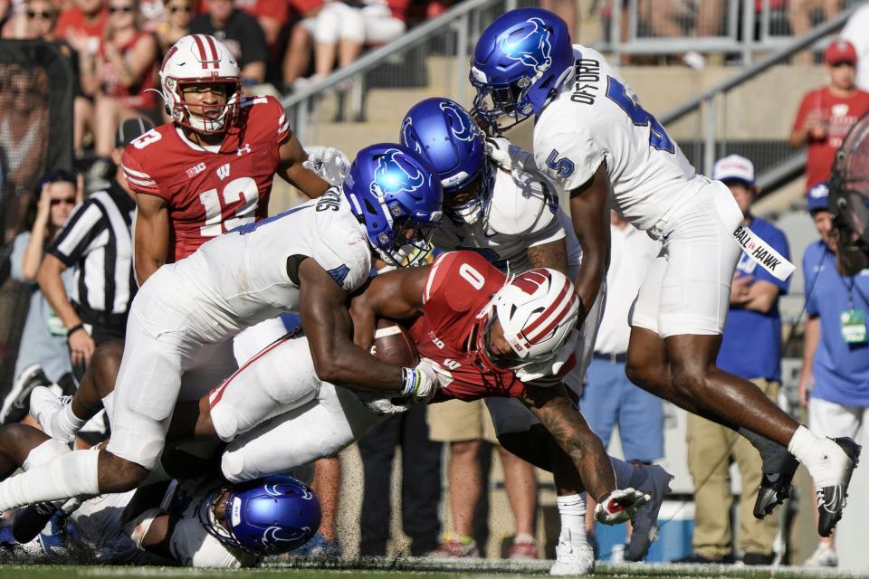 Wisconsin's Braelon Allen (0) is stopped during the second half of an NCAA college football game against Buffalo Saturday, Sept. 2, 2023, in Madison, Wis. (AP Photo/Morry Gash)