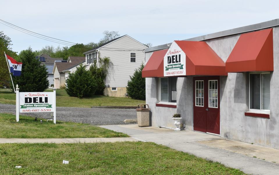 The former Hometown Deli in Paulsboro was used by three men in a securities fraud scheme, federal prosecutors allege.