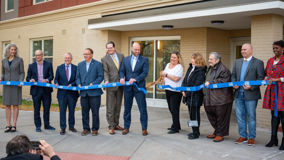 Local and state officials cut the ribbon for the Colonial II apartments in Rome, NY on Friday, March 8, 2024. This is the state's first carbon-neutral public housing development.