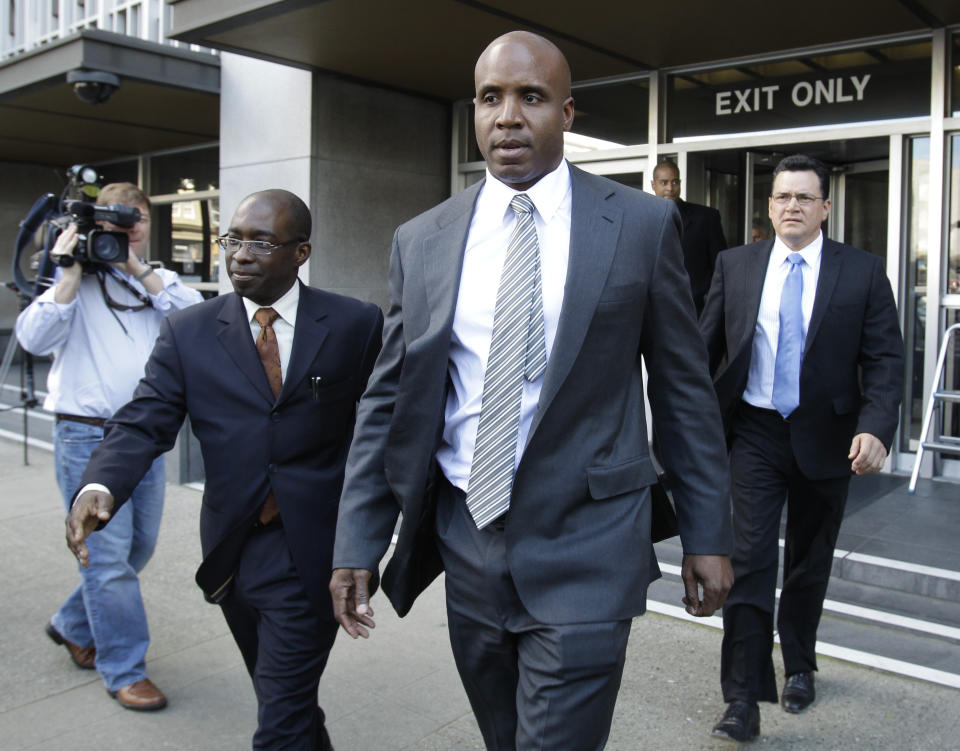 FILE - Former baseball player Barry Bonds leaves a federal courthouse on April 8, 2011, during his perjury trial in San Francisco. Barry Bonds, Roger Clemens and David Ortiz appear to be the only players with a chance at Hall of Fame enshrinement when results are unveiled Tuesday, Jan. 25, 2022, with Ortiz most likely to get in on his first try. Bonds and Clemens are each in their 10th and final turns under consideration by voters from the Baseball Writers' Association of America. (AP Photo/ Paul Sakuma, File)