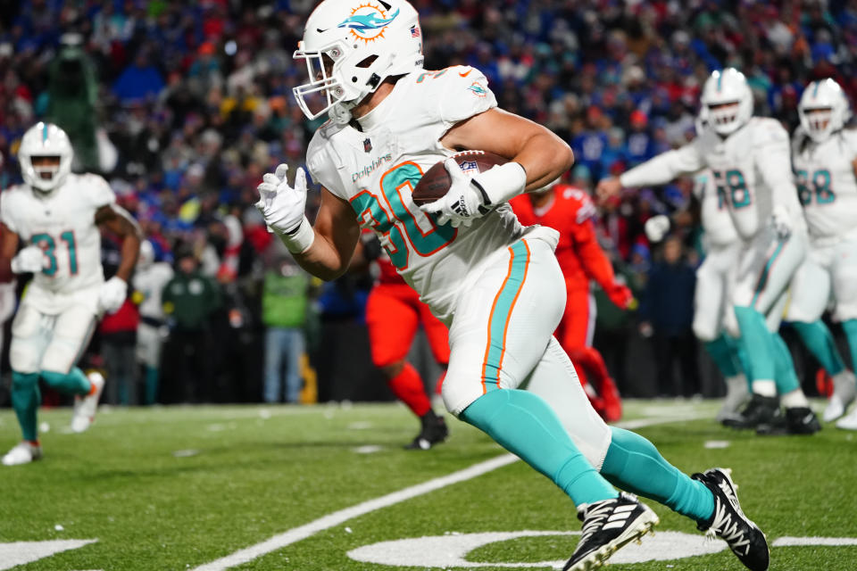 Dec 17, 2022; Orchard Park, New York, USA; Miami Dolphins full back Alec Ingold (30) runs with the ball against the <a class="link " href="https://sports.yahoo.com/nfl/teams/buffalo/" data-i13n="sec:content-canvas;subsec:anchor_text;elm:context_link" data-ylk="slk:Buffalo Bills;sec:content-canvas;subsec:anchor_text;elm:context_link;itc:0">Buffalo Bills</a> during the second half at Highmark Stadium. Mandatory Credit: Gregory Fisher-USA TODAY Sports