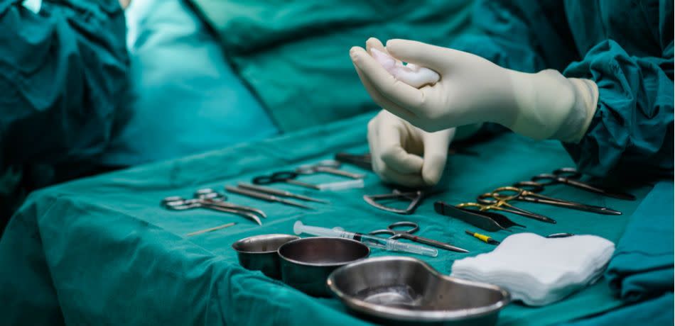 Pre-operative medical equipment in operating room.