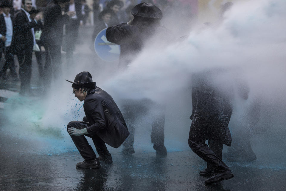 March 7, 2019 - Jerusalem, Israel - Israeli policemen use water cannons to disperse Ultra-Orthodox Jewish protesters during a demonstration against Israeli army conscription. (Credit Image: Ilia Yefimovich/DPA via ZUMA Press)