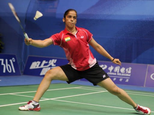 Indian badminton player Saina Nehwal plays a shot during the Asian Games in Guangzhou in November. A new ruling that requires female badminton players to wear skirts on court is causing unease among players as they prepare to adopt the new compulsory dress code