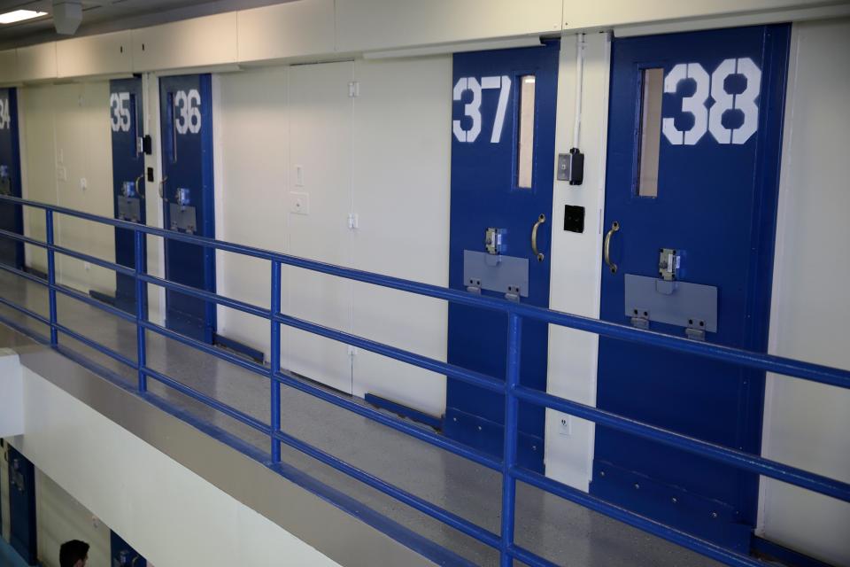 Numbered doors of an enhanced supervision housing unit, also commonly known as solitary confinement, are shown at the Rikers Island jail complex n New York.